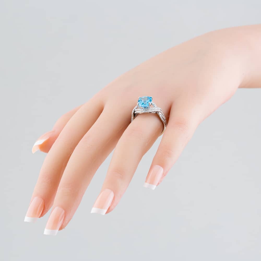 Pre-Owned 14ct White Gold Oval Cut Blue Topaz & Single Cut Diamond Crossover Ring 43451006