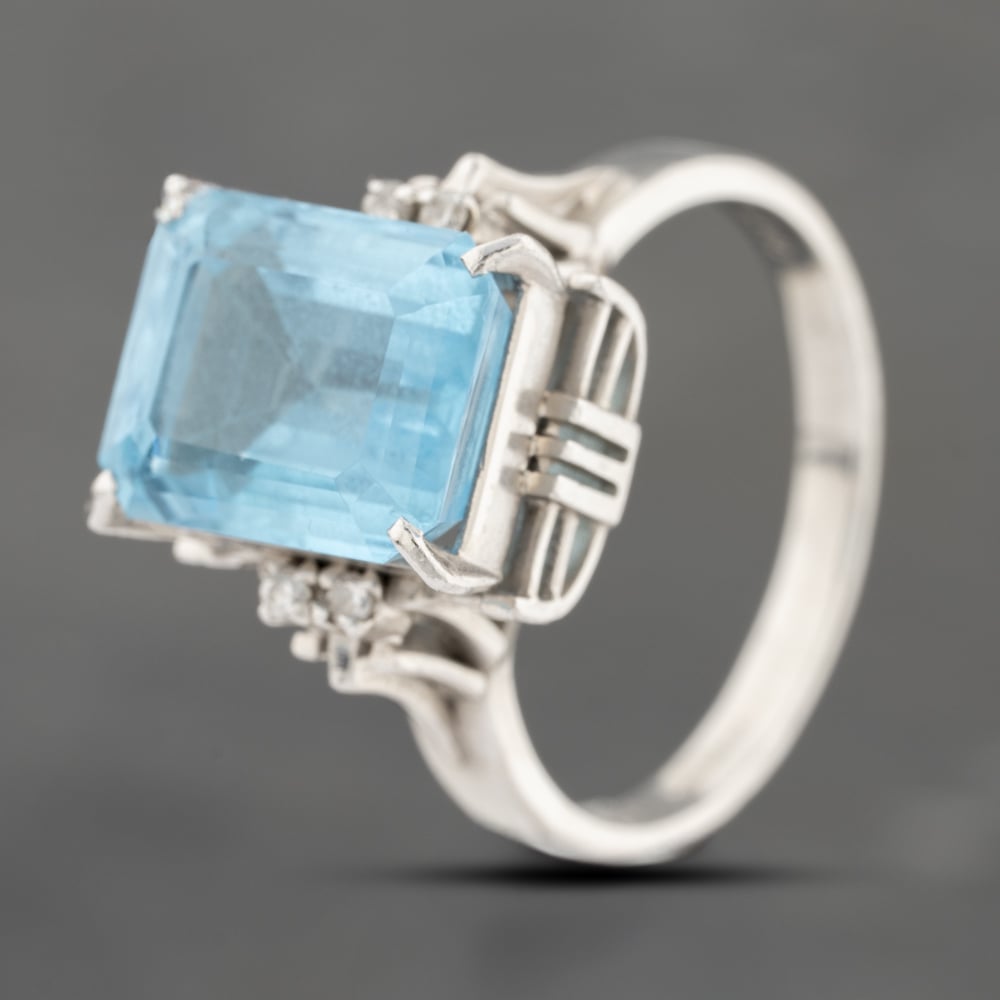 Click to view product details and reviews for Pre Owned Platinum 637ct Blue Topaz And 006ct Diamond Rectangular Dress Ring 43451015.