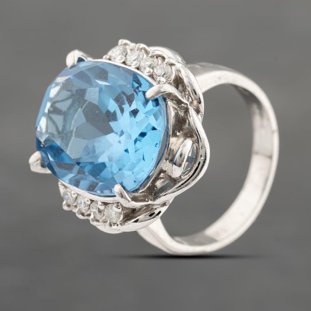 Click to view product details and reviews for Pre Owned Platinum 1243ct Blue Topaz And 021ct Brilliant Cut Diamond Oval Dress Ring 43451016.