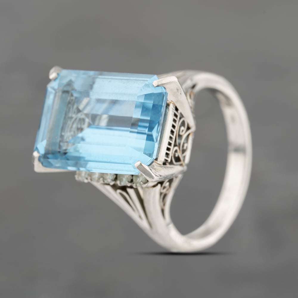 Click to view product details and reviews for Pre Owned Platinum 1128ct Blue Topaz And 020ct Diamond Oblong Dress Ring 43451018.