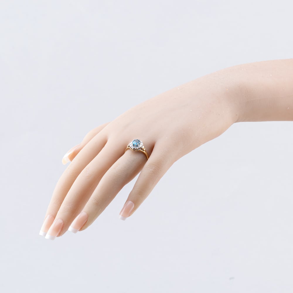 Pre-Owned 9ct Yellow Gold Blue Topaz & 0.05ct Diamond Heart Engraved Shoulders Oval Cluster Ring 43451021