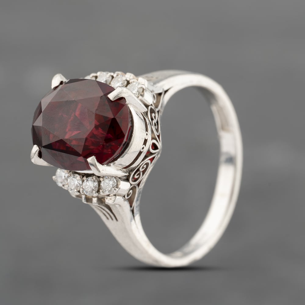 Click to view product details and reviews for Pre Owned Platinum 613ct Garnet And 013ct Diamond Oval Dress Ring 43471010.
