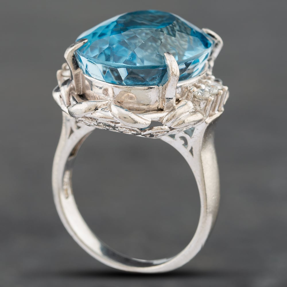 Pre-Owned Platinum Certificated 26.04ct Blue Topaz & 0.24ct Brilliant Cut Diamond Oval Dress Ring 43481008