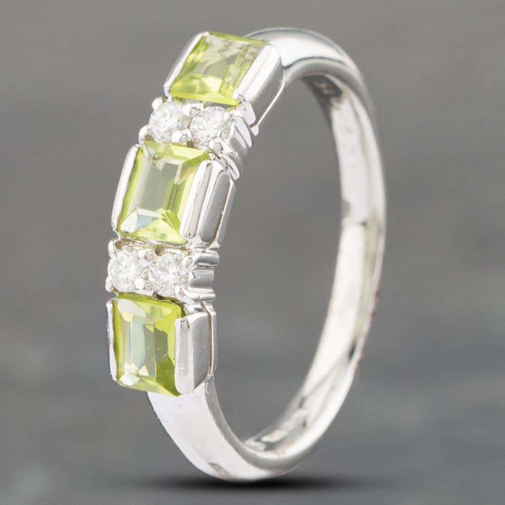 Product photograph of Pre-owned Platinum Peridot Amp 0 15ct Brilliant Cut Diamond Seven Stone Ring 43541003 from The Jewel Hut