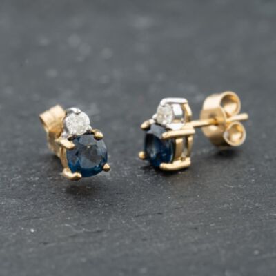 Pre-Owned 9ct Yellow Gold Blue Topaz & 0.12ct Brilliant Cut Diamond Stud Earrings 41174049