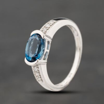 Pre-Owned 9ct White Gold Blue Topaz & 0.03ct Diamond Oval Cluster Ring 41383876