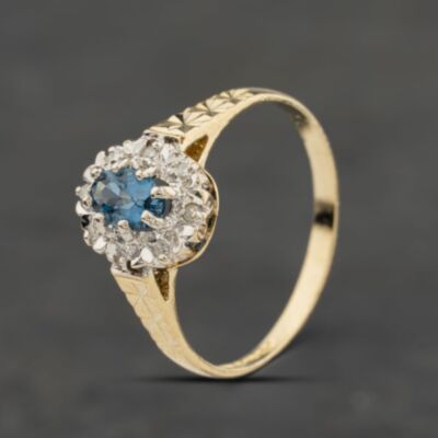 Pre-Owned 9ct Yellow Gold Blue Topaz & Diamond Oval Cluster Ring 41384044