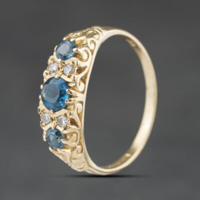 Pre-Owned 9ct Yellow Gold Blue Topaz & 0.08ct Diamond Seven Stone Ring 41384545