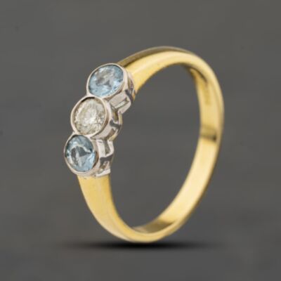 Pre-Owned 18ct Yellow Gold Aquamarine & 0.20ct Brilliant Cut Diamond Rubover Set Three Stone Ring 41482810