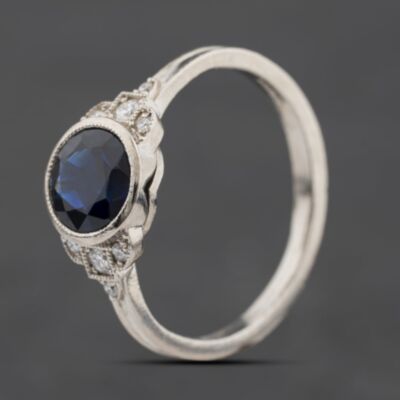 Pre-Owned Platinum Sapphire & 0.11ct Diamond Round Rubover Set Dress Ring 41482840