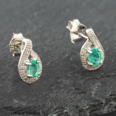 Pre-Owned White Gold 0.30ct Oval Cut Emerald & 0.03ct Diamond Swirl Stud Earrings 43171090