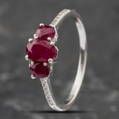 Pre-Owned 14ct White Gold Oval Cut Ruby & Diamond Set Shoulders Three Stone Ring 43351028