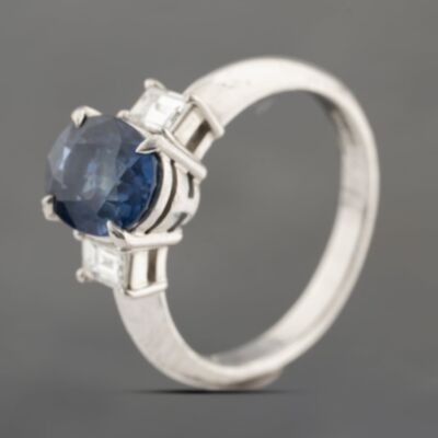 Pre-Owned Platinum 2.41ct Sapphire & 0.38ct Step Cut Diamond Three Stone Ring 43361182