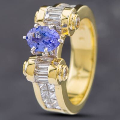 Pre-Owned 14ct Yellow Gold 0.88ct Oval Cut Tanzanite & Diamond Set Shoulders Dress Ring 43411018