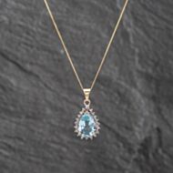 Pre-Owned 9ct Yellow Gold Blue Topaz & 0.01ct Diamond Pear Shape Pendant & 18 Inch Curb Chain 41142620
