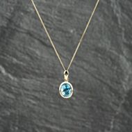 Pre-Owned 9ct Yellow Gold Blue Topaz Oval Set Pendant & 18 Inch Curb Chain 41143206