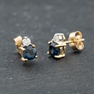 Pre-Owned 9ct Yellow Gold Blue Topaz & 0.12ct Brilliant Cut Diamond Stud Earrings 41174049