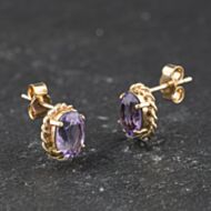 Pre-Owned Yellow Gold Amethyst Oval 9mm Stud Earrings 41174478