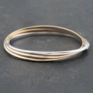 Pre-Owned 9ct Three Colour Gold Three Strand Crossover Standard Hinged Bangle 41211273