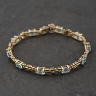 Pre-Owned 9ct Yellow Gold Blue Topaz 7.5 Inch Bracelet 41281904