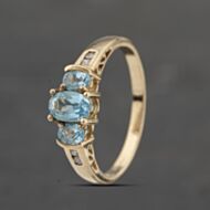 Pre-Owned 9ct Yellow Gold Blue Topaz & Diamond Oval Seven Stone Ring 41383391