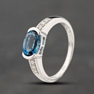 Pre-Owned 9ct White Gold Blue Topaz & 0.03ct Diamond Oval Cluster Ring 41383876