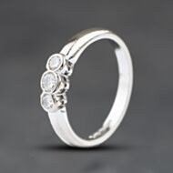 Pre-Owned 18ct White Gold 0.20ct Brilliant Cut Diamond Rub Over Set Three Stone Ring 41482827
