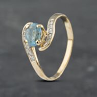 Pre-Owned 14ct Yellow Gold Blue Topaz & 0.10ct Diamond Twist Ring 41671502