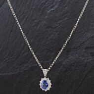 Pre-Owned Platinum Oval Sapphire and Brilliant Cut Diamond Pendant 4314602