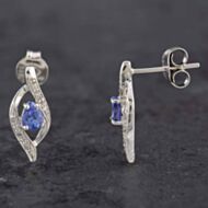 Pre-Owned 9ct White Gold 0.14ct Tanzanite & Diamond Swirl Stud Earrings 43170095