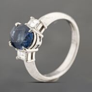 Pre-Owned Platinum 2.41ct Sapphire & 0.38ct Step Cut Diamond Three Stone Ring 43361182