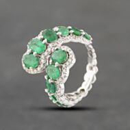 Pre-Owned 18ct White Gold Emerald & 0.56ct Brilliant Cut Diamond Graduated Multi-Cluster Crossover Dress Ring 43371061