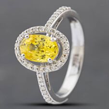 Pre-Owned 18ct White Gold Oval Cut Yellow Sapphire & Brilliant Cut Diamond Halo Ring 43361094