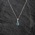 Pre-Owned 9ct White Gold Blue Topaz & Diamond Pendant & 16 Inch Curb Chain 41143247