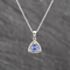 Pre-Owned White Gold Tanzanite & 0.08ct Diamond Halo Cluster Pendant & 18 Inch Trace Chain 41143642
