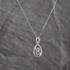 Pre-Owned 18ct White Gold 0.20ct Diamond Swirl Pendant & 18 Inch Curb Chain 41143646