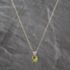 Pre-Owned Yellow Gold Peridot Oval Pendant & 18 Inch Curb Chain 41143693