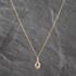 Pre-Owned Yellow Gold Diamond Knot Loop Pendant & 18 Inch Curb Chain 41143695