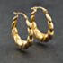 Pre-Owned Yellow Gold Oval Embossed Creole Earrings 41174209