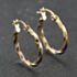 Pre-Owned Yellow Gold 21mm Twisted Hoop Earrings 41174236