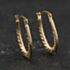Pre-Owned Yellow Gold Oval Patterned Creole Earrings 41174627