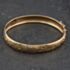 Pre-Owned 9ct Yellow Gold Half Engraved Hinged Bangle 41211473
