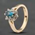 Pre-Owned 9ct Yellow Gold Blue Topaz & 0.08ct Diamond Oval Cluster Ring 41384897