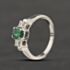 Pre-Owned 18ct White Gold Emerald & 0.20ct Princess Cut Diamond Oval Three Stone Ring 41482245