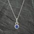 Pre-Owned 14ct White Gold 0.94ct Tanzanite & 0.27ct Diamond Round Cluster Pendant 4314542