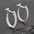 Pre-Owned 14ct White Gold 17mm 0.25ct Brilliant Cut Diamond Oval Hoop Earrings 43171200