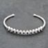 Pre-Owned 18ct White Gold Sapphire & 0.90ct Diamond Flexible Multi Cluster Medium Torque Bangle 43211016