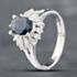 Pre-Owned Platinum 1.65ct Oval Cut Sapphire & 0.34ct Brilliant Cut Diamond Cluster Ring 43361013