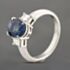 Pre-Owned Platinum 2.41ct Sapphire & 0.38ct Step Cut Diamond Three Stone Ring 43361182